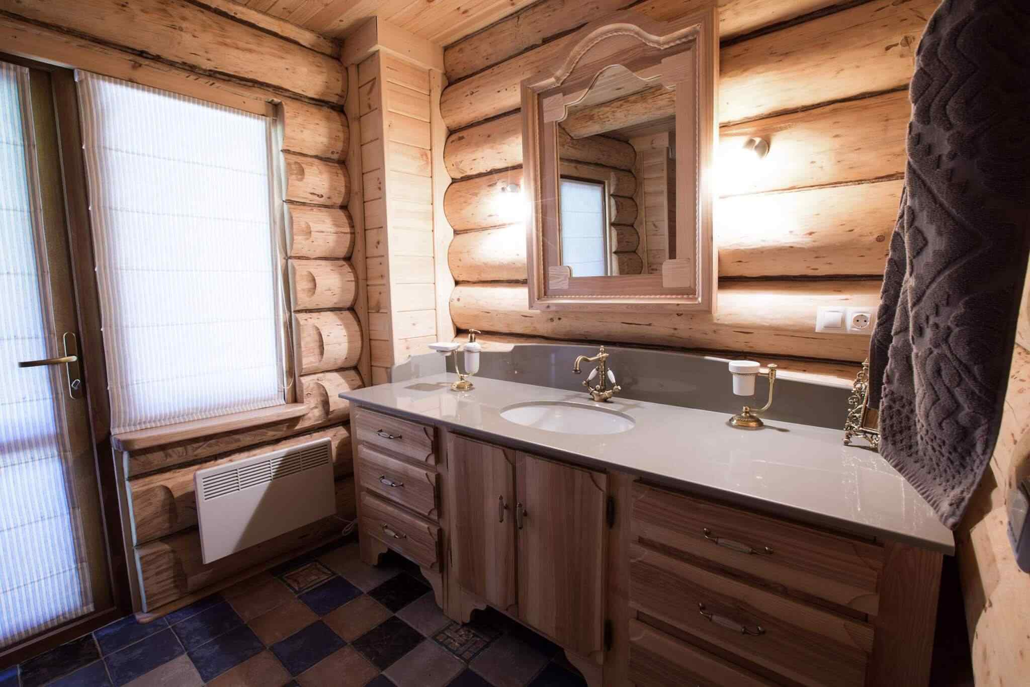 A bathroom with wooden walls and floors.