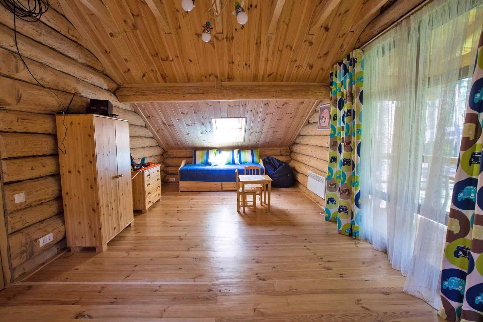 A room with wooden floors and walls.