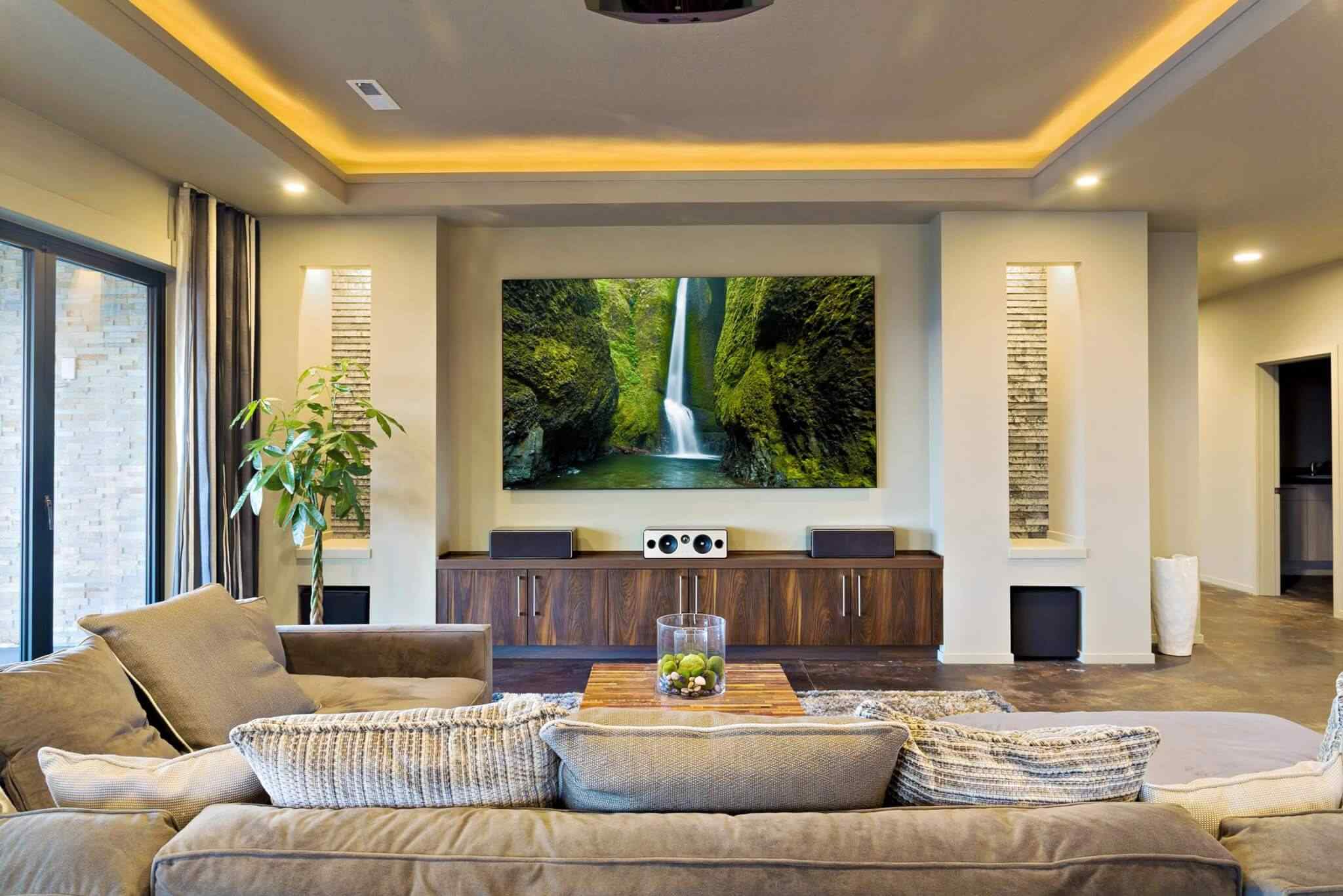 A living room with a large television and couch