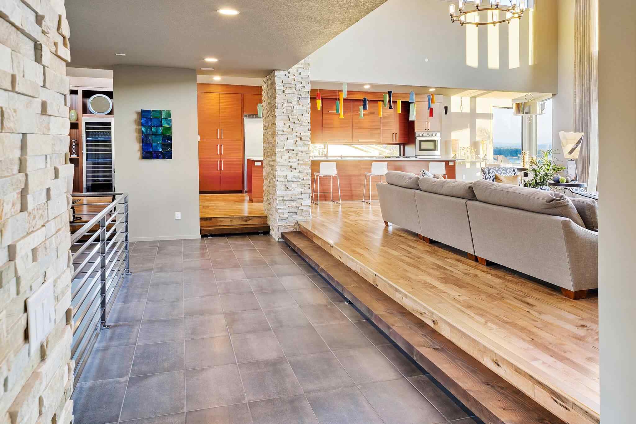 A living room with wooden floors and white walls.