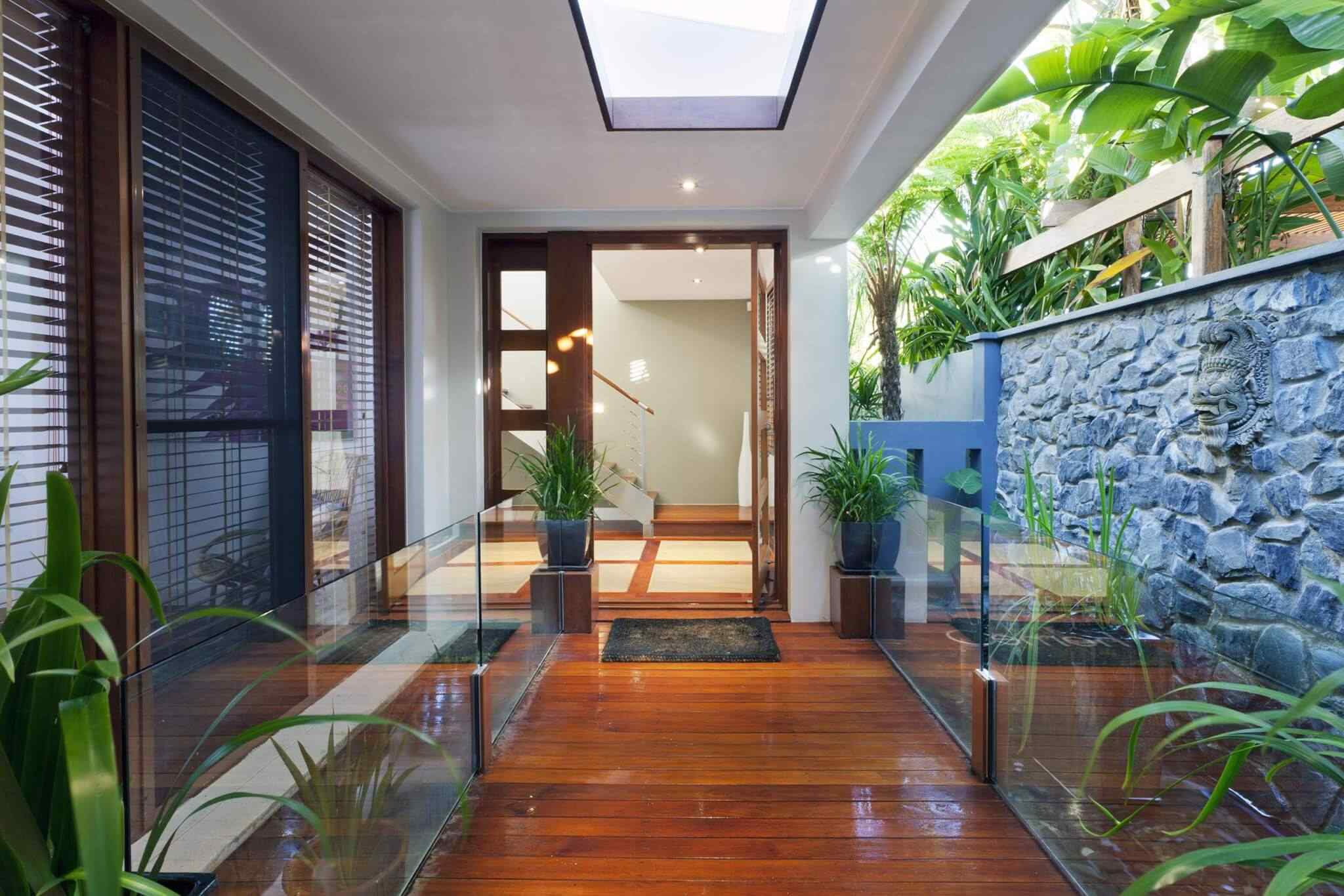A large open door leading to the outside of a house.