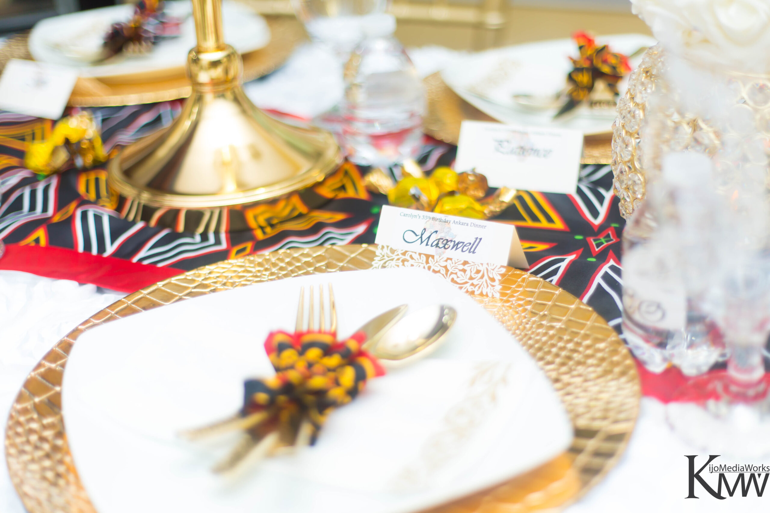 A table set with plates, silverware and place cards.