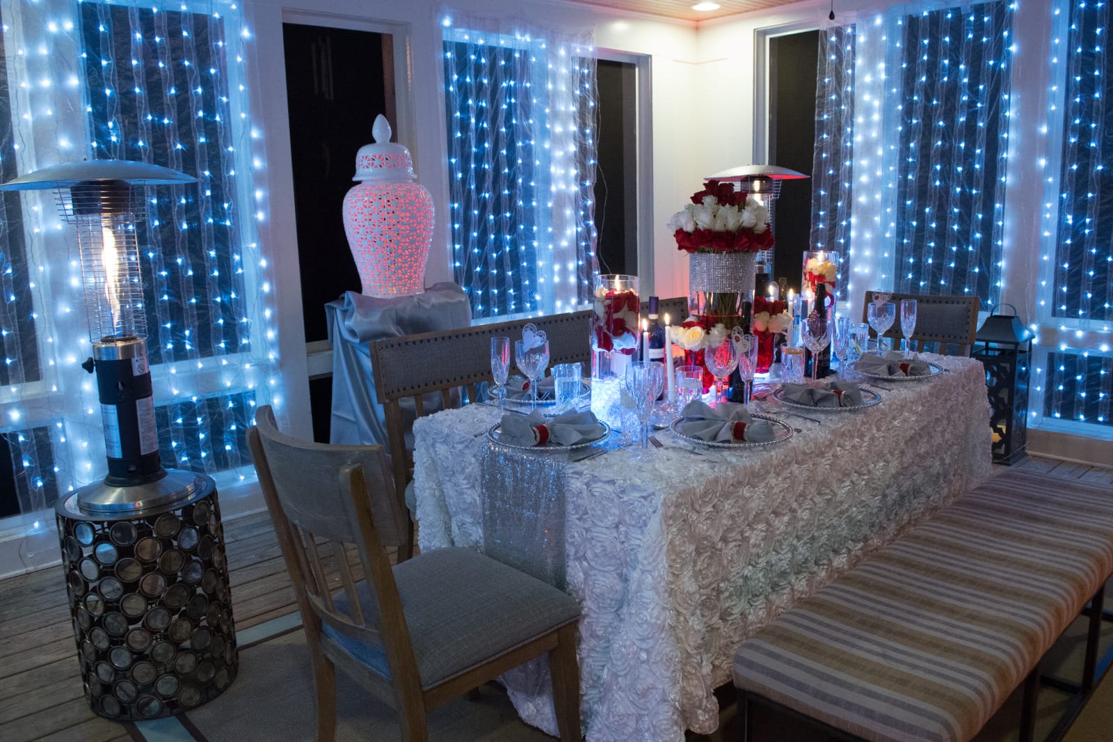 A table set up with candles and lights.